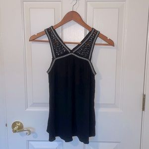 XS black top with lace v-neck straps and white accent